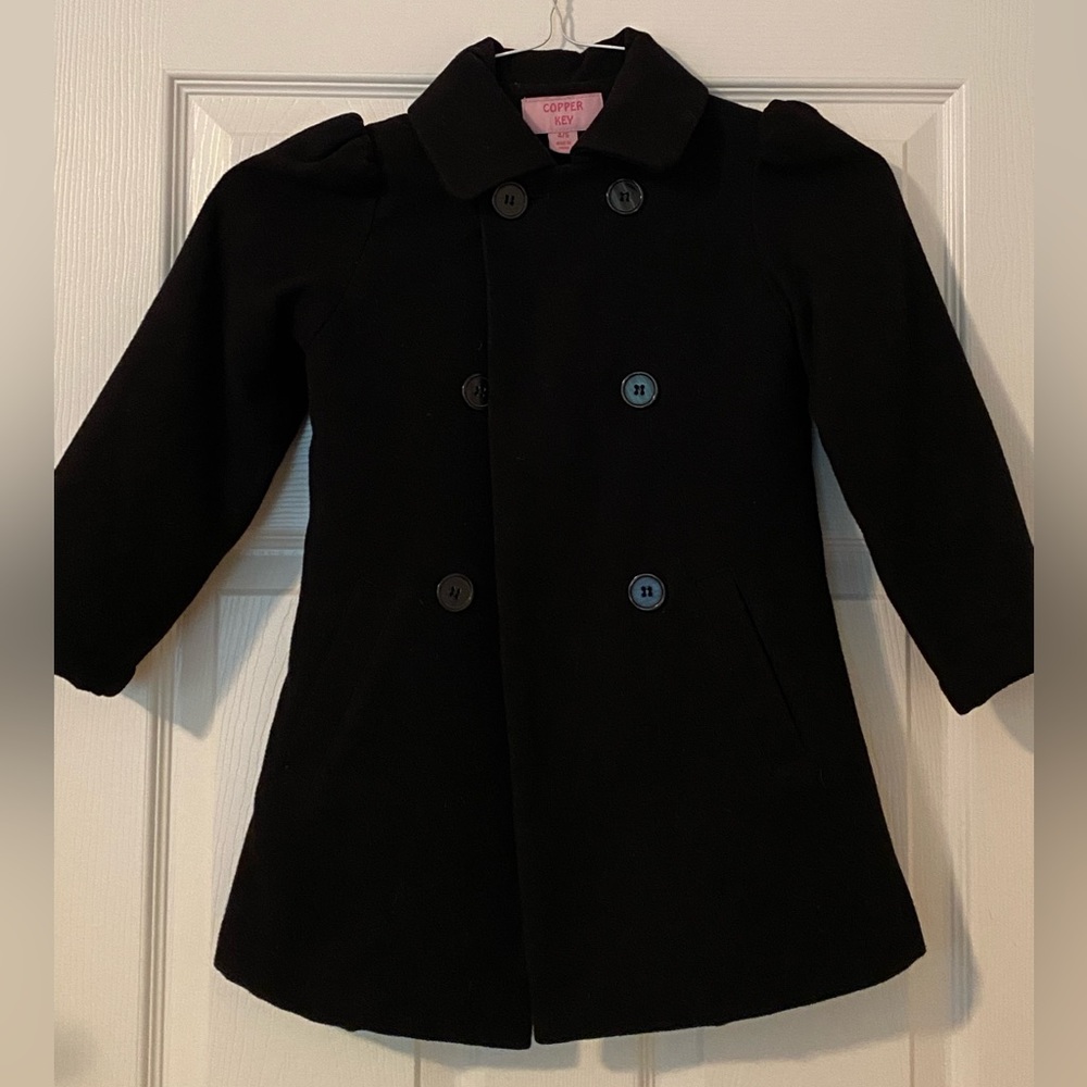 Child’s black formal coat; worn once